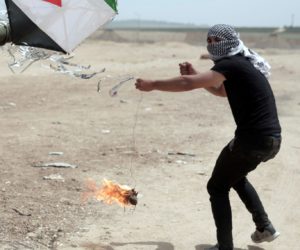 Palestinian rioters fly an arson terror kite at the Gaza border. (AP Photo/ Khalil Hamra)