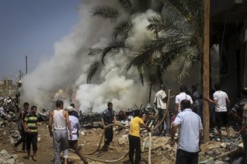 Palestinians gather at the site of an explosion that ripped through a house in the Al-Shabura refugee camp near the southern Gaza Strip town of Rafah on August 6, 2015. An explosion killed four Palestinians and wounded 30 on Thursday in the southern Gaza town of Rafah along the Egyptian border, medical officials and local residents said. Media outlets of the Hamas Islamist group that controls the Gaza Strip blamed the blast on an unexploded Israeli missile from last year's war. The Hamas-run Interior Ministry said it was checking the cause of the explosion, which destroyed the home of Ayman Abu Nqeira, a Hamas member. Photo by Abed Rahim Khatib/ Flash90