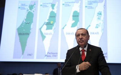 Turkey's President Recep Tayyip Erdogan with maps of Israel. (Kayhan Ozer/Pool Photo via AP)