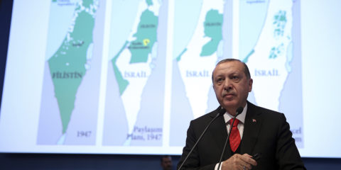 Turkey's President Recep Tayyip Erdogan with maps of Israel. (Kayhan Ozer/Pool Photo via AP)