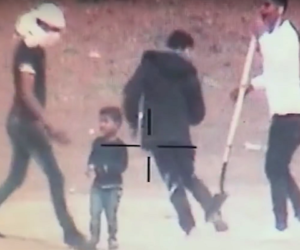 Palestinian terrorists use a child as a human shield in Gaza. (screenshot)