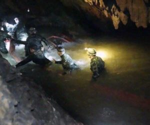 Rescue teams walk inside cave complex where 12 boys and their soccer coach went missing in northern Thailand July 2, 2018. (Tham Luang Rescue Operation Center via AP)
