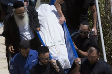 Terror victim Yotam Ovadia's funeral in Jerusalem. (AP Photo/Sebastian Scheiner)