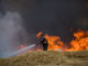 Israeli firefighters battle a previous fire caused by Palestinian terrorists' kites. (Yonatan Sindel/Flash90)