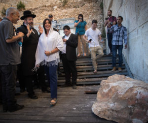 Chief Rabbi David Lau with the director-general of the Israel Antiquities Authority, Israel Hasson, and he boulder that fell. (Yonatan Sindel/Flash90)