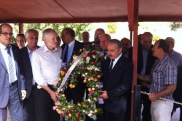 Jeremy Corbyn, second from left, with a wreath at a memorial to "Martyrs of Palestine."(Facebook)