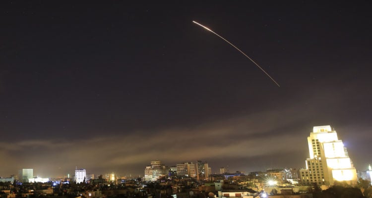 Blasts from area of military airport shake Damascus; Syria denies Israeli airstrike