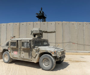 An Israeli army vehicle near the new concrete barrier between Israel and Lebanon. (Basel Awidat/Flash90)