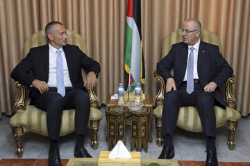 Nickolay Mladenov (R) and Palestinian Prime Minister Rami Hamdallah. (AP Photo/Prime Minister Office)