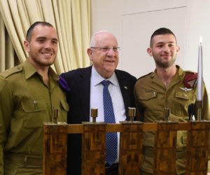 President Rivlin lighting Chanukah candles with ultra-Orthodox soldiers. (Mark Neiman/GPO)