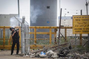 An Israeli policeman responding to previous Palestinian riots at Ofer Prison. (Photo by Flash90)