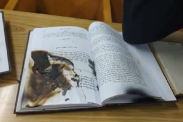 Damaged holy book from vandalized Netanya synagogue. (Israel Police)