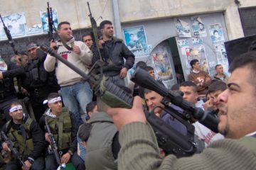 Palestinians shoot in the air to honor martyrs. (Haytham Ashtiyeh /Flash90)