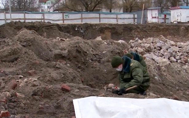 Skeleton of mother cradling baby discovered at Holocaust mass grave site in Belarus
