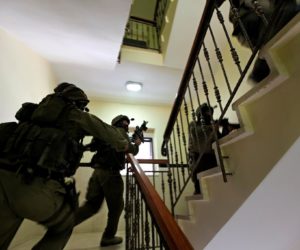 Israeli security forces arrest the suspect. (Israel Police/Facebook)