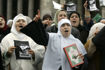Muslim women in Belgium protest cartoons of Muhammad. (AP Photo/Yves Logghe)