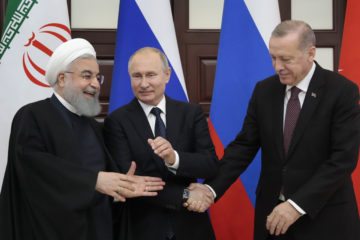 Russian President Vladimir Putin, center, Iranian President Hassan Rouhani, left, and Turkish President Recep Tayyip Erdogan. (Sergei Chirikov/Pool Photo via AP)