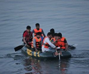 Migrants on a dinghy heading for Europe. (AP Photo/Lefteris Pitarakis)