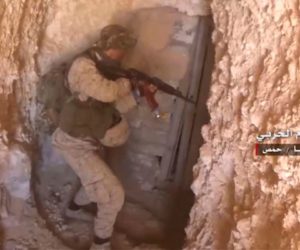 Syrian soldier raiding a tunnel in Homs provence. (Syrian Central Military Media, via AP)