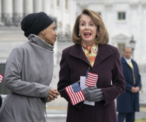 Rep. Ilhan Omar, D-Minn., left, joins Speaker of the House Nancy Pelosi, D-Calif. (AP Photo/J. Scott Applewhite)