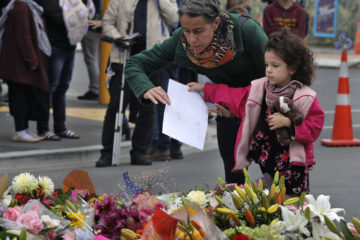 Mourners pay their respects at a makeshift memorial in Christchurch, New Zealand. (AP Photo/Vincent Yu)