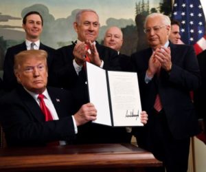 President Donald Trump and a signed proclamation recognizing Israel's sovereignty over the Golan Heights. (AP Photo/Susan Walsh)