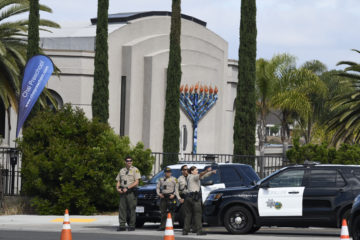 San Diego county sheriff deputies stand in front of the Chabad of Poway. (AP Photo/Denis Poroy)