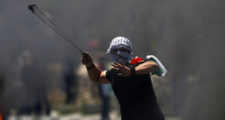 10,000 Palestinians riot at Israel-Gaza border with violence, flames