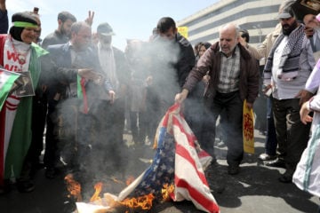 Iranians burn a U.S. flag on May 10, 2019. (AP Photo/Ebrahim Noroozi)