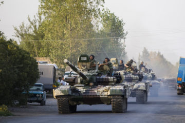 A convoy of Azerbaijan's Army tanks moves in the direction of Agdam, Azerbaijan. (AP Photo/Abbas Atilay )
