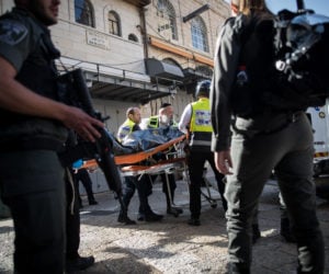 Israeli security forces and medics remove the body of a Palestinian terrorist who stabbed two Israelis in the Old City on May 31, 2019. (Yonatan Sindel/Flash90)