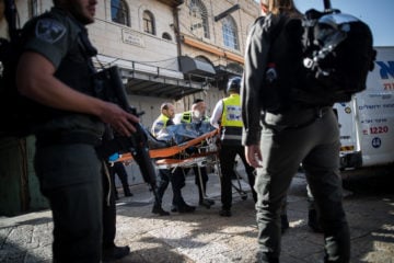 Israeli security forces and medics remove the body of a Palestinian terrorist who stabbed two Israelis in the Old City on May 31, 2019. (Yonatan Sindel/Flash90)