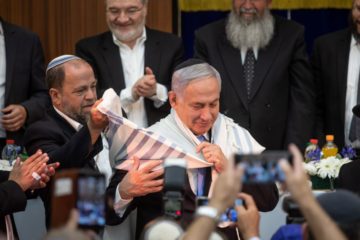 Benjamin Netanyahu receives the prayer shawl fallen IDF soldier Zachary Baumel on Jerusalem Day. (Aharon Krohn/Flash90 )