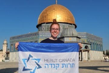 Lauren Isaacs with Herut Flag
