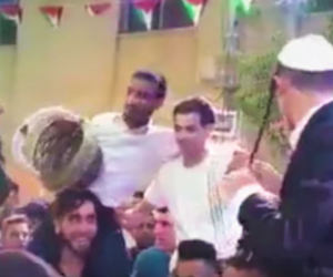 Jewish Israelis dance at a Palestinian wedding in Deir Kadis. (screenshot)