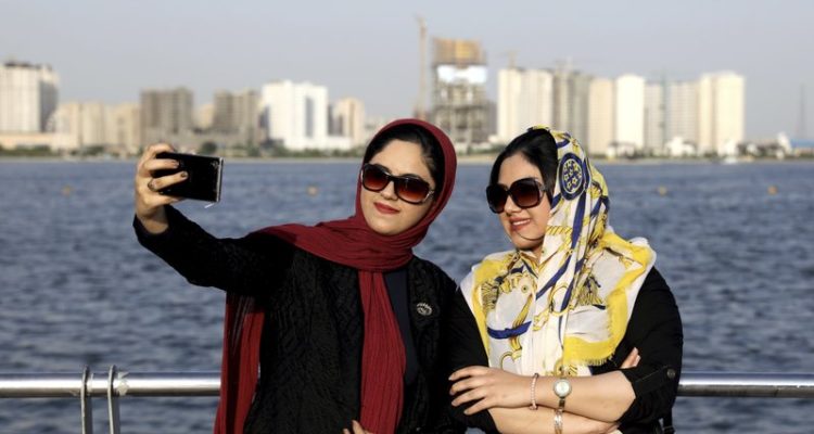 In Iran, some women take off their hijabs as hard-liners push back