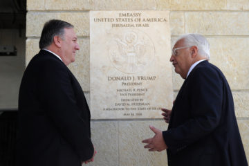 U.S. Secretary of State Mike Pompeo and U.S. Ambassador to Israel David Friedman stand next to the dedication plaque at the U.S. embassy in Jerusalem.