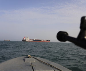 A speedboat of Iran's Revolutionary Guard trains a weapon toward the British-flagged oil tanker Stena Impero, which was seized in the Strait of Hormuz.