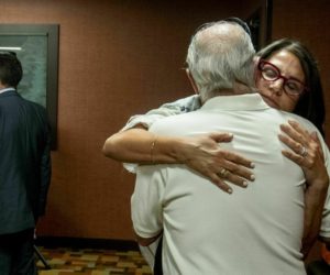 Tanya Gersh, a Montana real estate agent, embraces her father, Lloyd Rosenstein, following a hearing at the Russell Smith Federal Courthouse on Thursday, July 11, 2019, in Missoula.