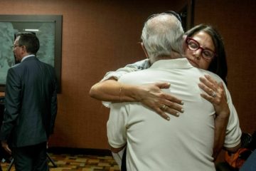 Tanya Gersh, a Montana real estate agent, embraces her father, Lloyd Rosenstein, following a hearing at the Russell Smith Federal Courthouse on Thursday, July 11, 2019, in Missoula.