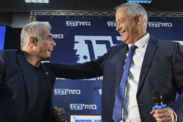 Top Blue and White figures Benny Gantz (r) and Yair Lapid speak during a campaign event on August 7, 2019