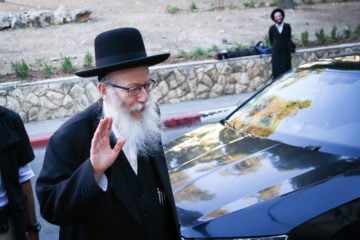 Deputy Health Minister Yaakov Litzman arrives at his home in Jerusalem on August 6, 2019.