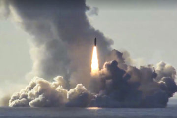 In this photo made from the footage taken from Russian Defense Ministry official web site on Thursday, May 24, 2018, a Russian nuclear submarine test-fires missiles from the White Sea.