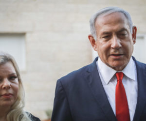 Prime Minister Benjamin Netayahu and his wife Sara speak with the media outside the Sorek family home, in Ofra on August 13, 2019.