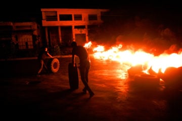 Palestinians burn tires near Joseph's Tomb on July 2, 2019, as thousands of Jews made their way to visit the site.