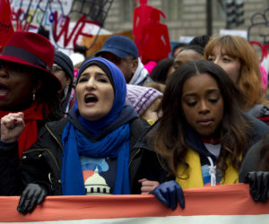 Co-presidents of the 2019 Women's March Linda Sarsour, center, and Tamika Mallory, right, march along with other demonstrators on Pennsylvania Av. during the Women's March in Washington on Saturday, Jan. 19, 2019.
