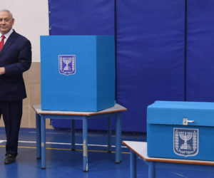 Israeli Prime Minister Benjamin Netanyahu casts his vote at a polling station in Jerusalem during the Knesset Elections, on April 9, 2019.