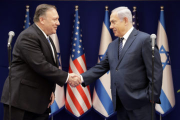 U.S. Secretary of State Mike Pompeo, left, shakes hands with Israeli Prime Minister Benjamin Netanyahu, during a meeting at the Prime Minister's Residence in Jerusalem, Friday, Oct. 18, 2019.