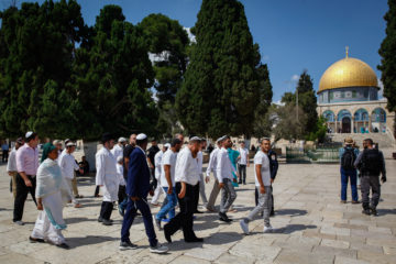 Israeli security forces escort a group of religious Jews as they visit the Temple Mount in Jerusalem's Old City.