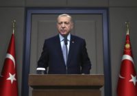 Turkish President Recep Tayyip Erdogan talks to reporters before traveling to Russia to meet with Russian President Vladimir Putin, in Ankara, Tuesday, Oct. 22, 2019.